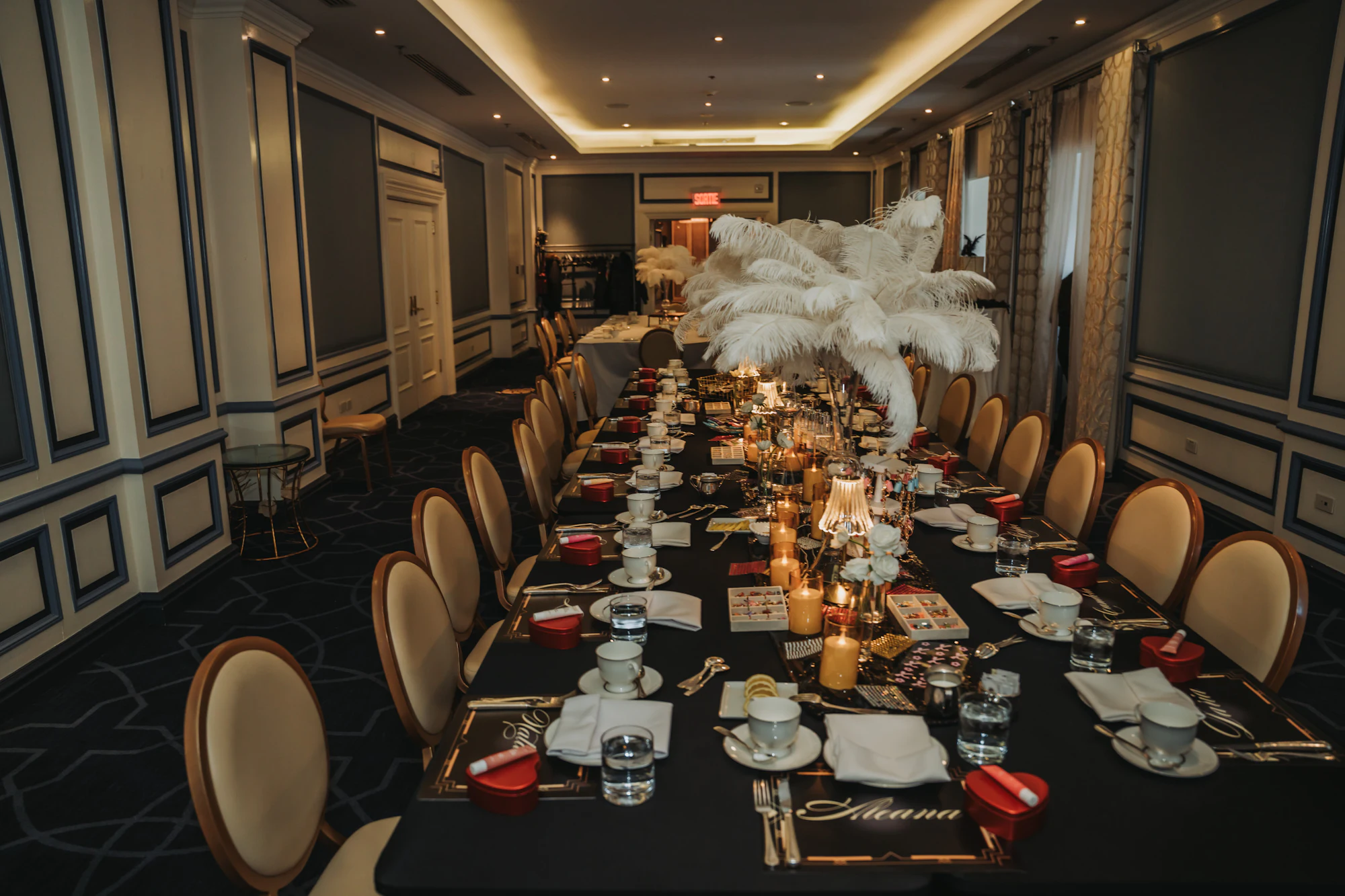A long, elegantly dressed table set for a formal dinner