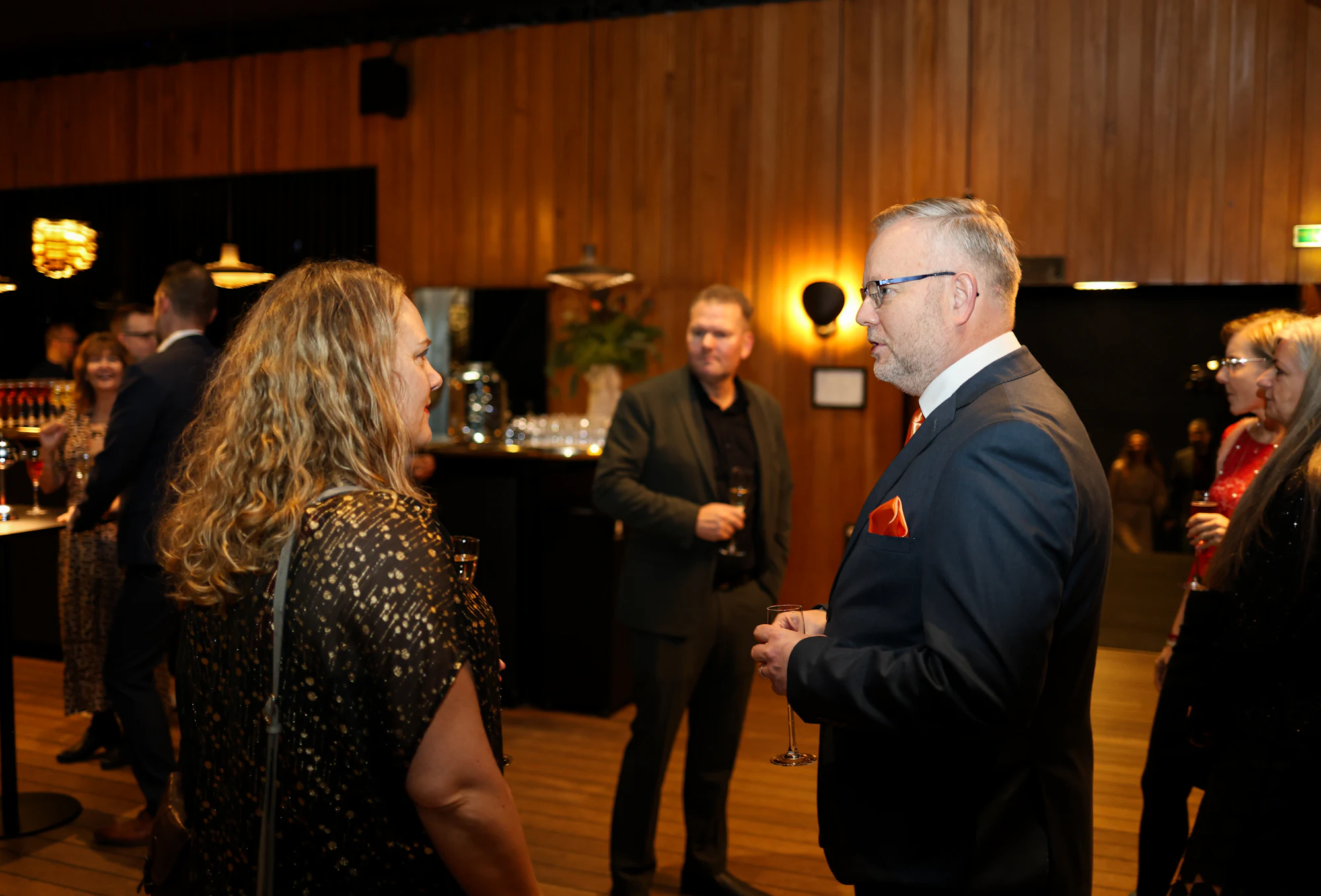 Guests mingling at an evening event